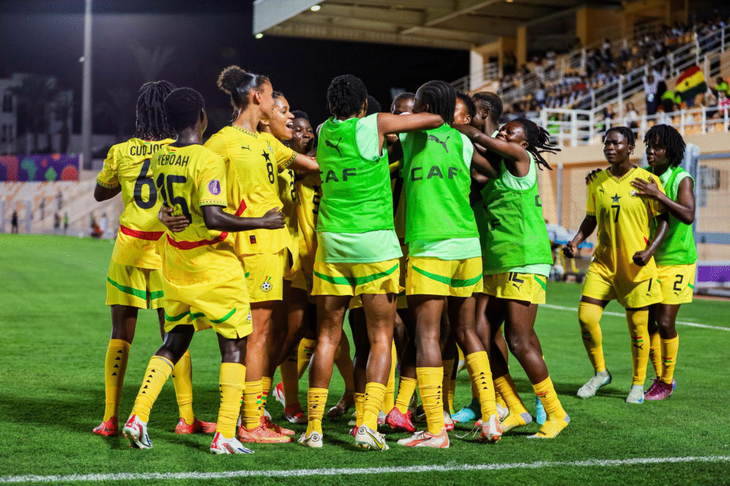 Ghana's Black Queens football team celebrating a victory on the pitch