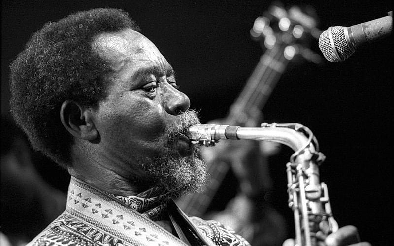 Archival photo of E.T. Mensah performing highlife music with a brass band in Ghana, symbolizing the foundation of Afrobeat.