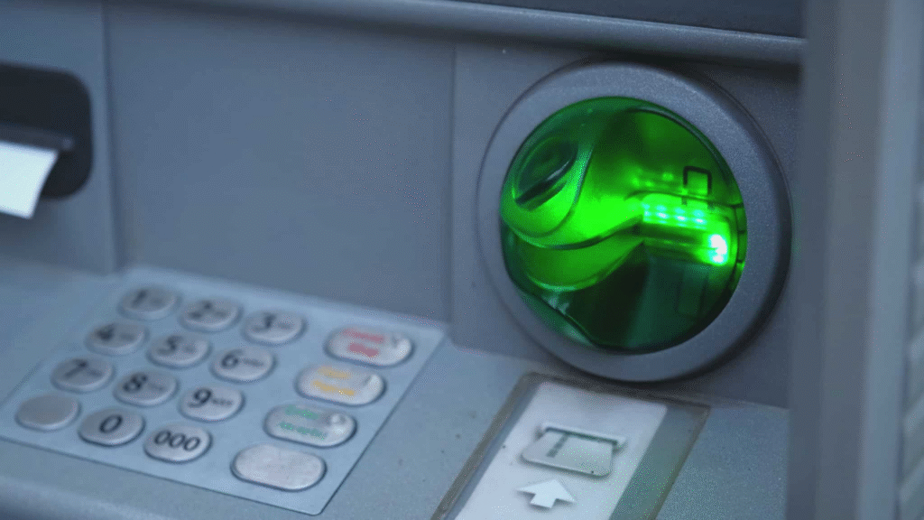 Close-up of an ATM card slot equipped with an anti-skimming device to prevent data theft.