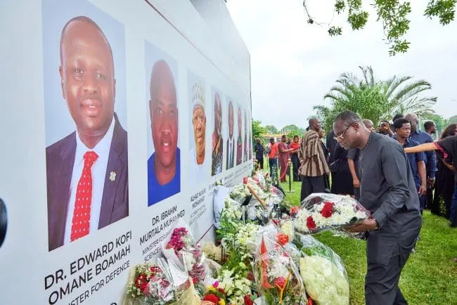 Ghanaians paying tribute to the victims of the helicopter crash, reflecting national grief.