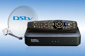 DStv decoder and remote on a table, symbolizing price cuts in Ghana