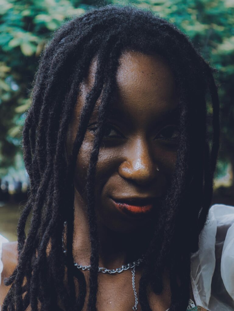 Portrait of a Ghanaian woman confidently embracing her natural skin tone, representing safer alternatives to skin bleaching.
