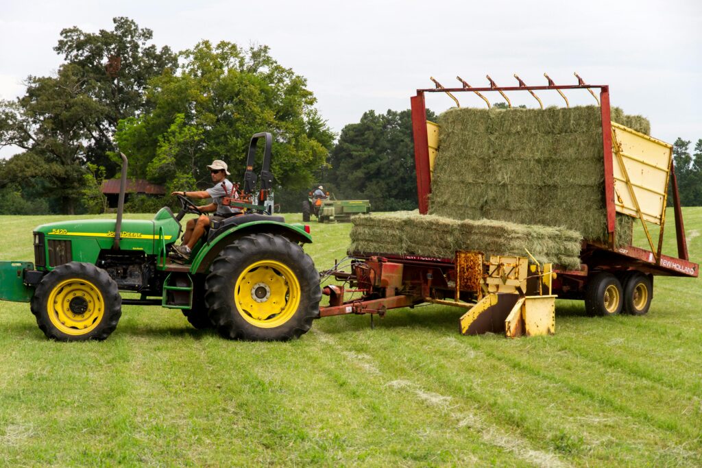 Smallholder farmers in Ghana renting tractors to plough fields for maize cultivation.