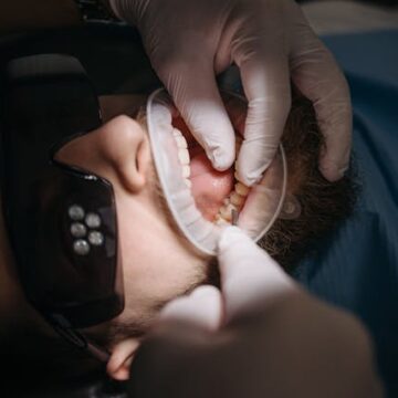 Dentist performing check-up in a clinic
