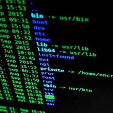 Programming code on screen illustrating cybersecurity and multifactor authentication protection.